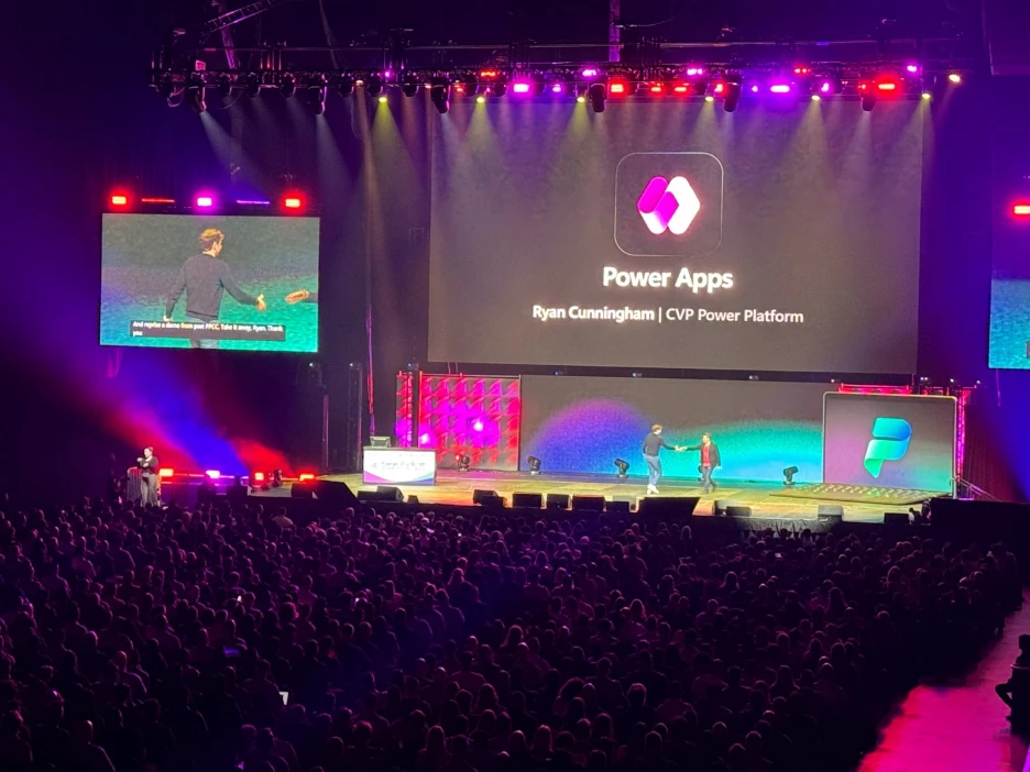 Power Apps keynote presentation on stage at the Power Platform Community Conference.